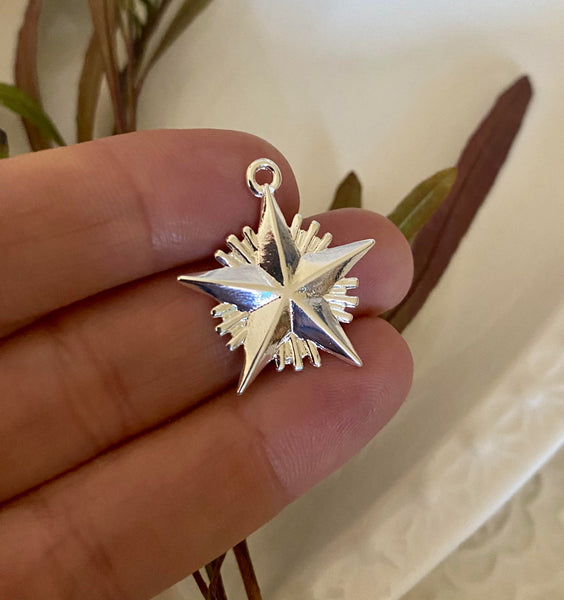 COLGANTE ESTRELLA GUIA CON RAYOS PLATA 2.6CM